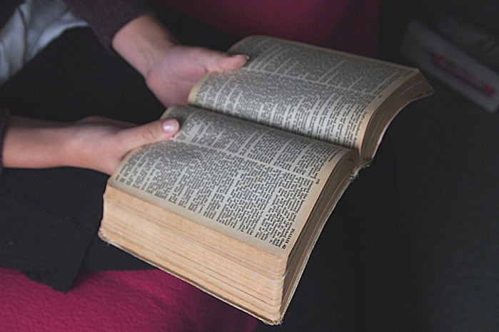 open bible hands light